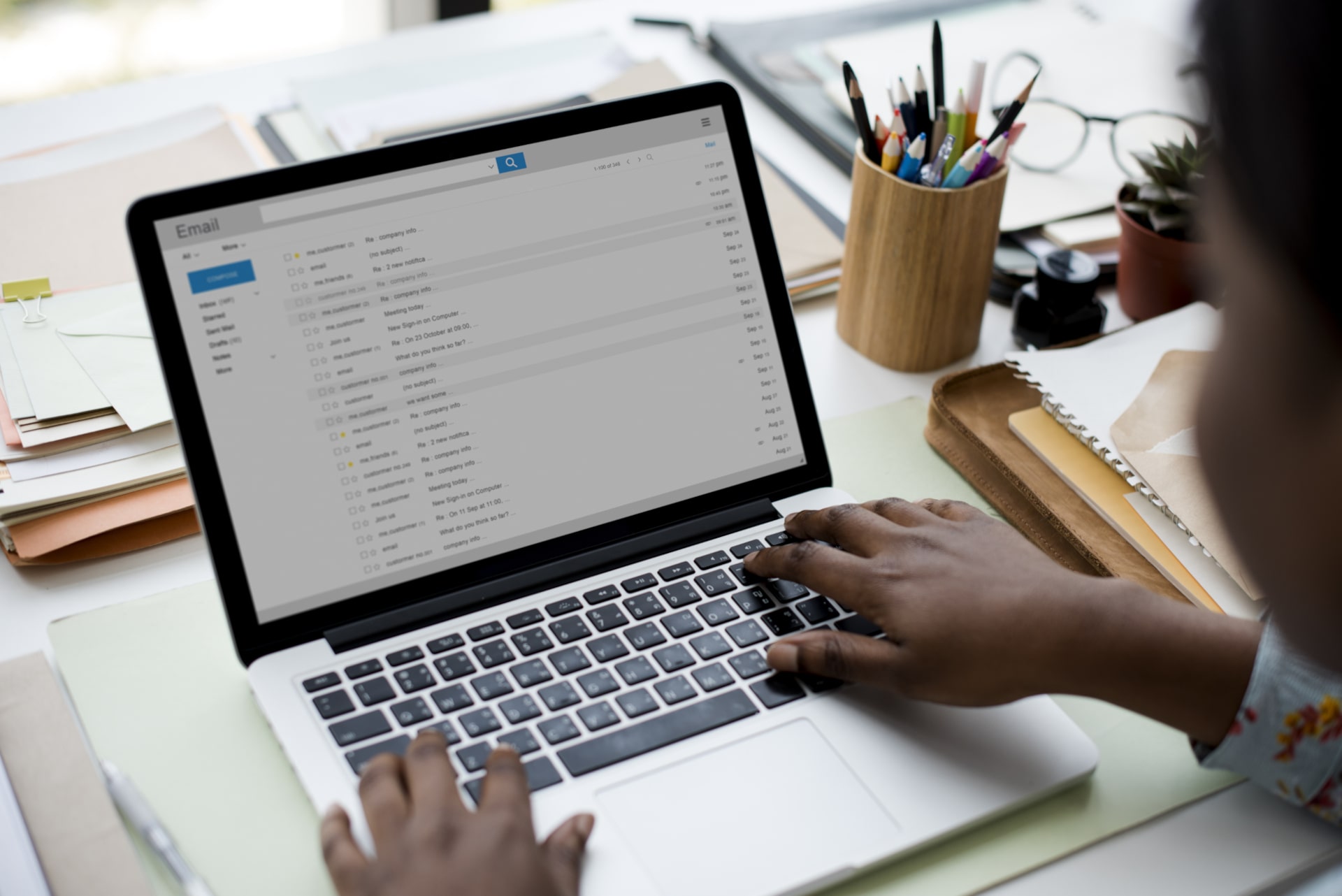 Person checking their emails on a laptop